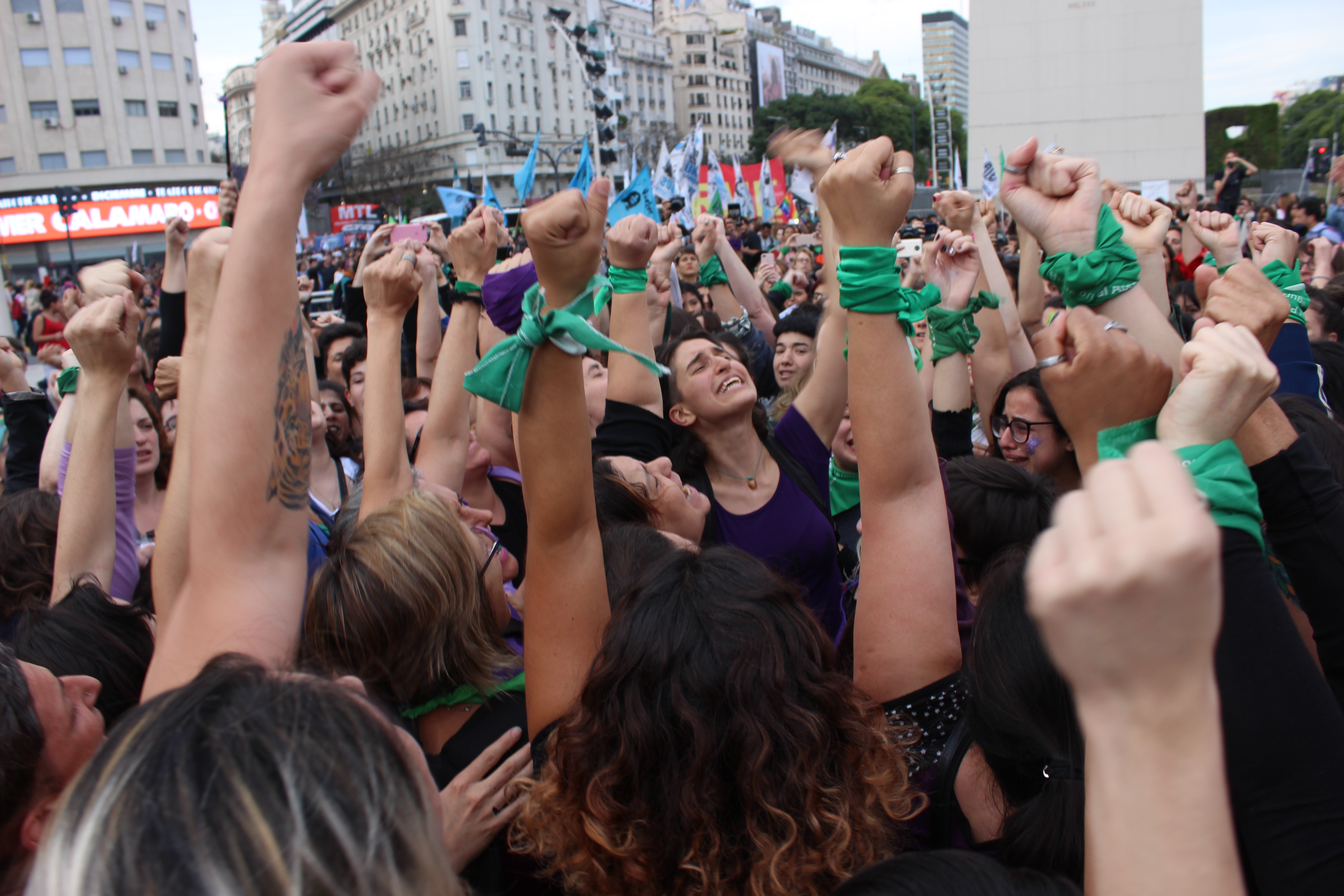 Protestors with green wristbands punch the air in Buenos Aires, Argentina, 5 December 2018. 